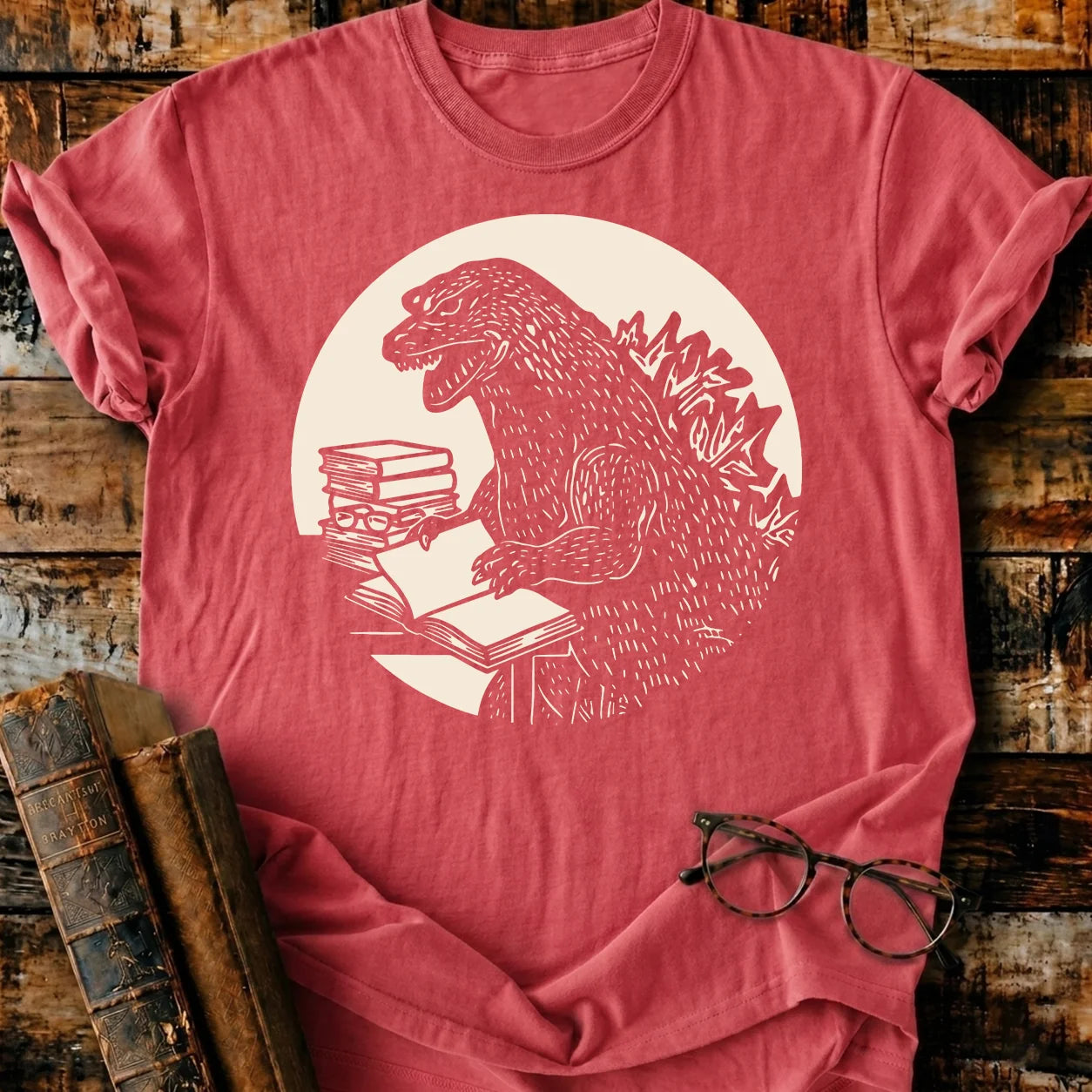 Red Comfort Colors Readzilla T-shirt with Godzilla reading books, relaxed fit, 100% US cotton.